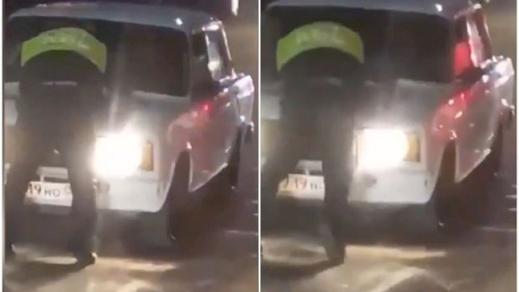 Sürücü yol polisini avtomobilinin kapotunun üstündə “gəzdirdi” - Video